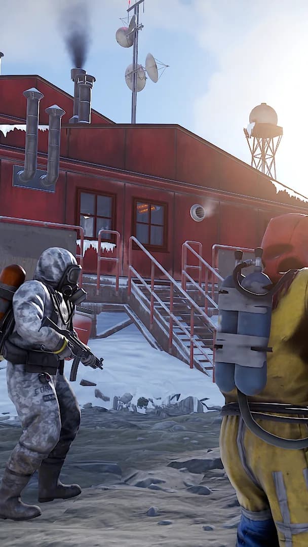 Rust: two armed players at a snowy monument
